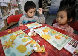 Children create a picture with sweet dough