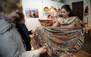 Women considering scarves