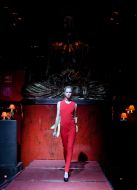 The model demonstrates a dress