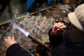 Glassblower blows Christmas toy