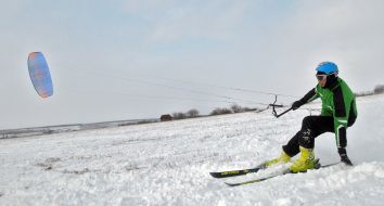 Skier riding a kite