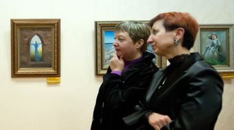 A visitors views a picture