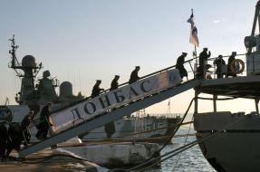 Sailors climb aboard