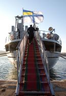 Sailors climb aboard