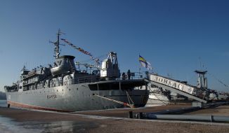 Sailors climb aboard