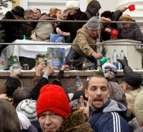 Believers collect water