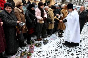 A priest blesses the water