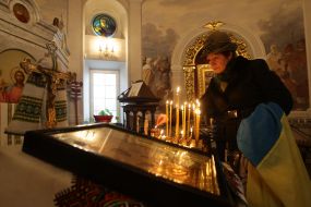 Woman lighting a candle