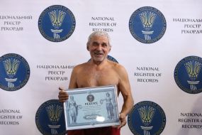 Vladimir Trofimets demonstrates a diploma