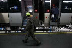 Worker inspects a train
