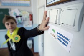 Schoolboy turns off light