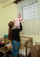 A woman is holding a baby