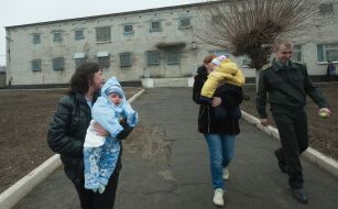 Women with children are accompanied by prison staff