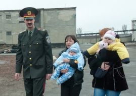 Oleg Kozich accompanies women with children