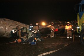 Rescue workers on the site of the crash