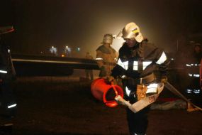 Rescue workers on the site of the crash