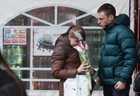 Man with balloons and roses