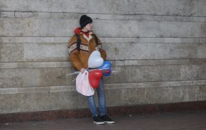 Man with balloons and roses