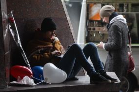 Man with balloons and roses