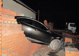 Mazda car rode into in a private house