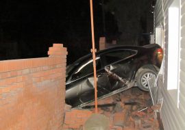 Mazda car rode into in a private house