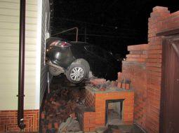 Mazda car rode into in a private house