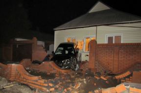 Mazda car rode into in a private house