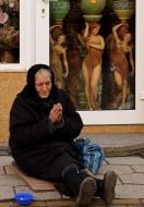 An elderly woman begging for alms