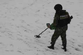 Soldier with mine detector