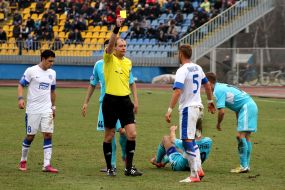 Referee shows a yellow card