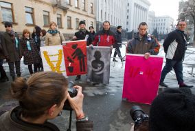 Representatives of public organizations hold placards