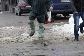 A man in rubber boots