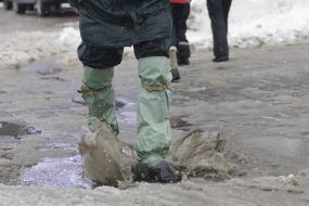 A man in rubber boots