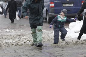 A man in rubber boots