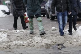 A man in rubber boots