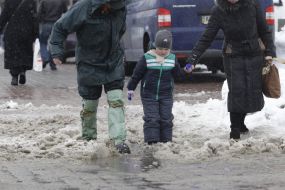A man in rubber boots