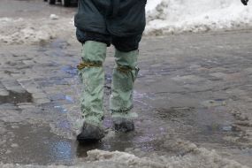 A man in rubber boots
