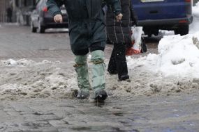 A man in rubber boots