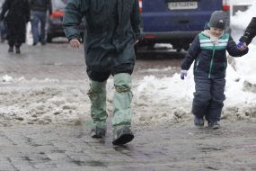 A man in rubber boots