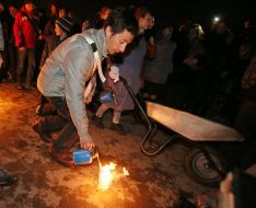 Young man light a fire