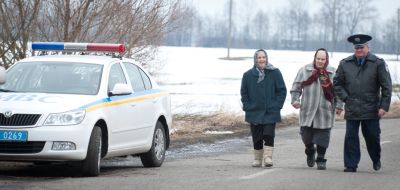 Traffic policeman is on the road with women