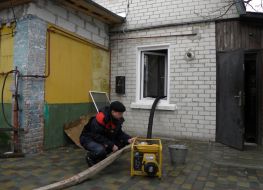 Emergency workers pumping water