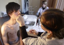 A doctor examines a draftee