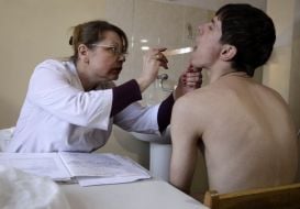 A doctor examines a draftee 