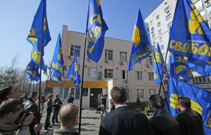 Participants of the picket holding flags