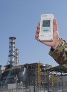 A man holds a dosimeter