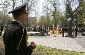 Serviceman of honor guard company holding lamp
