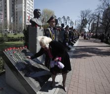 A woman lays flowers