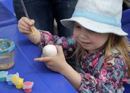 A girl decorate Easter Egg