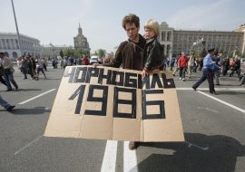 A man holds a placard